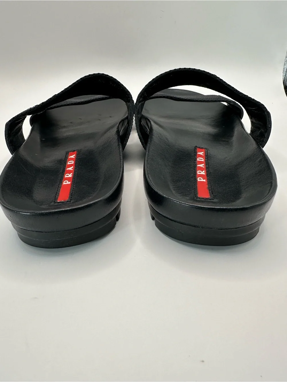 Prada Black Leather and Fabric Double-Strap Slides with Red Insole Detail